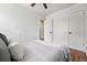 Bedroom showcasing hardwood floors, fresh paint, ceiling fan, closet and a view of the bathroom at 3344 W 33Rd Ave, Denver, CO 80211