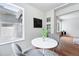 Charming dining space with a round table, stylish chairs, and a built-in cabinet at 3344 W 33Rd Ave, Denver, CO 80211