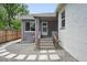 Charming home exterior featuring a gray brick facade, stone walkway, and freshly painted accents at 3344 W 33Rd Ave, Denver, CO 80211