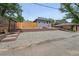 A detached grey brick garage and red brick retaining wall adds privacy at 3344 W 33Rd Ave, Denver, CO 80211