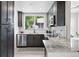 Modern kitchen with granite countertops, stainless steel appliances, and updated cabinetry at 3344 W 33Rd Ave, Denver, CO 80211