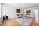 Well-lit living area with hardwood floors, contemporary furnishings, and stylish artwork at 3344 W 33Rd Ave, Denver, CO 80211