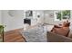 Open living space showcasing hardwood floors, an airy layout, and views to kitchen and front entrance at 3344 W 33Rd Ave, Denver, CO 80211