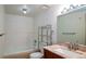 Classic bathroom with a tiled bathtub, marble countertop vanity, and neutral walls offers a clean aesthetic at 800 N Pearl St # 602, Denver, CO 80203
