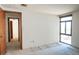 Bright bedroom with neutral walls, carpet, a large window, and an adjacent room offers versatility at 800 N Pearl St # 602, Denver, CO 80203