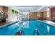 Inviting indoor pool area features blue water, brick walls, and large windows for natural light and recreation at 800 N Pearl St # 602, Denver, CO 80203