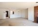 Open-concept living room offers a brick fireplace, neutral carpet, and ample space for comfortable living at 800 N Pearl St # 602, Denver, CO 80203