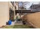 Private outdoor patio featuring comfortable seating, landscaping, and building signage, creating an inviting retreat at 800 N Pearl St # 602, Denver, CO 80203