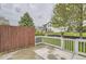 Backyard with fenced patio and view of house at 7498 W Saratoga Pl, Littleton, CO 80123
