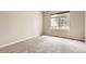 Bedroom features neutral walls and plush carpeting at 7498 W Saratoga Pl, Littleton, CO 80123