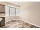 Bright dining nook with bay windows and modern light fixture at 7498 W Saratoga Pl, Littleton, CO 80123
