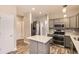 Well-equipped kitchen with stainless steel appliances, ample counter space, and modern fixtures at 7498 W Saratoga Pl, Littleton, CO 80123
