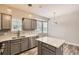 Modern kitchen featuring gray cabinetry, stainless steel appliances, and a kitchen island at 7498 W Saratoga Pl, Littleton, CO 80123
