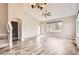 Spacious living room featuring hardwood floors, high ceilings, and a staircase at 7498 W Saratoga Pl, Littleton, CO 80123