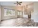 Open living area with high ceilings, hardwood floors, and plenty of natural light at 7498 W Saratoga Pl, Littleton, CO 80123
