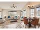 Staged living room with vaulted ceiling, ample windows, and stylish decor at 7498 W Saratoga Pl, Littleton, CO 80123