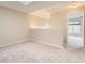 Loft area with neutral walls and carpet and views to other rooms, perfect for relaxation or study at 7498 W Saratoga Pl, Littleton, CO 80123