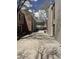 View of the backyard and patio area, framed by two-story home exteriors in brick and siding at 805 E 7Th Ave # 8, Denver, CO 80218