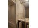 A view of the bathroom with a bathtub, sink, mirror, and tile shower at 805 E 7Th Ave # 8, Denver, CO 80218