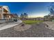 Landscaped backyard with artificial turf and fire pit at 3308 Carabiner St, Castle Rock, CO 80108