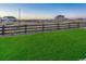 Artificial turf backyard with wooden fence and neighborhood view at 3308 Carabiner St, Castle Rock, CO 80108