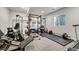 Basement home gym with various equipment including treadmill and weights at 3308 Carabiner St, Castle Rock, CO 80108