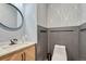 Stylish powder room with geometric wallpaper and modern fixtures at 3308 Carabiner St, Castle Rock, CO 80108