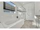 Spa-like bathroom featuring a soaking tub and a separate glass shower at 3308 Carabiner St, Castle Rock, CO 80108