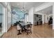 Open concept dining room with a rustic farmhouse table and built-in wet bar at 3308 Carabiner St, Castle Rock, CO 80108