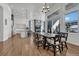 Open concept dining area with a large farmhouse table and kitchen views at 3308 Carabiner St, Castle Rock, CO 80108