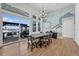 Bright dining room with wooden table and chairs, and access to backyard patio at 3308 Carabiner St, Castle Rock, CO 80108