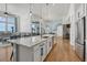 Spacious kitchen featuring a large island, stainless steel appliances, and hardwood floors at 3308 Carabiner St, Castle Rock, CO 80108