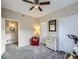Neutral bedroom with large windows, closet, and an exercise machine at 8481 W Union Ave # 4-203, Littleton, CO 80123