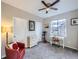 Multi-purpose bedroom featuring a desk, exercise equipment, and dresser at 8481 W Union Ave # 4-203, Littleton, CO 80123