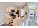 Updated kitchen with stainless steel appliances, breakfast bar, and ample natural light at 8481 W Union Ave # 4-203, Littleton, CO 80123