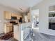 A view of the kitchen features bar seating, stainless steel appliances, and ample cabinet space at 8481 W Union Ave # 4-203, Littleton, CO 80123
