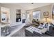 Cozy living room with vaulted ceilings, carpet floors, built-in shelving and fireplace at 8481 W Union Ave # 4-203, Littleton, CO 80123