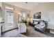 Bright living room with vaulted ceilings, plush seating, and access to an outdoor patio area at 8481 W Union Ave # 4-203, Littleton, CO 80123