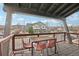 Cozy balcony with table set for four overlooking neighborhood townhomes at 3644 Pinedale St, Boulder, CO 80301