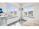 Bright bedroom with large windows overlooking the outside at 3644 Pinedale St, Boulder, CO 80301