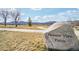 Pleasant View Fields entrance is marked by a boulder sign with scenic views and a walking path at 3644 Pinedale St, Boulder, CO 80301
