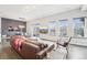 Inviting living room with hardwood floors, leather sofa, and natural light at 3644 Pinedale St, Boulder, CO 80301