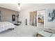 Bright main bedroom with barn door to ensuite bathroom and included exercise equipment at 3644 Pinedale St, Boulder, CO 80301