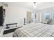 Spacious bedroom featuring a barn door to ensuite bathroom and natural light at 3644 Pinedale St, Boulder, CO 80301