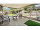 Outdoor patio with seating and a lush backyard with tiered landscaping, ideal for relaxation and entertaining at 6251 W 74Th Ave, Arvada, CO 80003