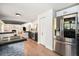 Open concept kitchen with stainless steel appliances, stylish cabinetry, and an island at 6251 W 74Th Ave, Arvada, CO 80003