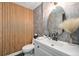 Contemporary powder room with wood slat wall accent, modern fixtures, and sleek vanity at 6251 W 74Th Ave, Arvada, CO 80003