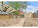 Spacious backyard featuring a pergola, wood fence, and lots of potential at 2350 N Ogden St, Denver, CO 80205