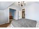 Bedroom featuring a light blue ceiling with a chandelier and white trim door frames at 2350 N Ogden St, Denver, CO 80205