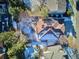 Overhead view of a house with a large backyard and surrounding homes at 3481 Meadow Creek Pl, Highlands Ranch, CO 80126